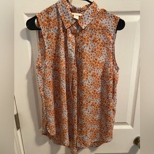 H&M. Sleeveless floral blouse.